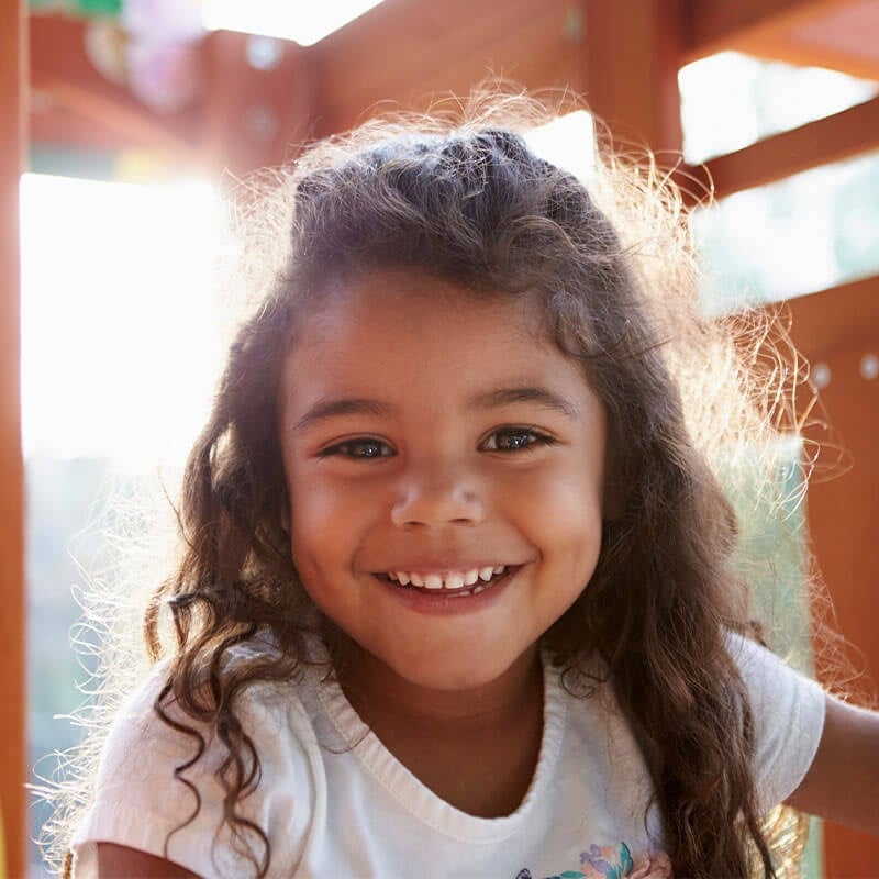 Smiling Child at the Playground